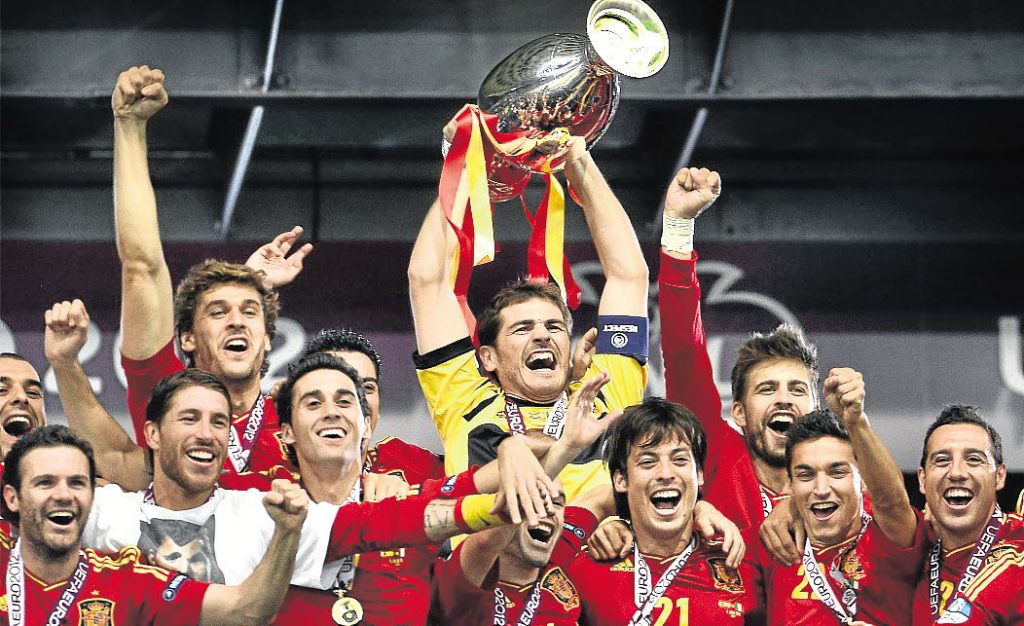 Spanish goalkeeper Iker Casillas holds the trophy as he celebrates with teammates after winning the Euro 2012 football championships final match Spain vs Italy on July 1, 2012 at the Olympic Stadium in Kiev. Spain won 4-0.